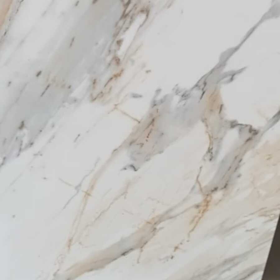 Close-up of a marble-look porcelain tile surface showing its veining and edge detail