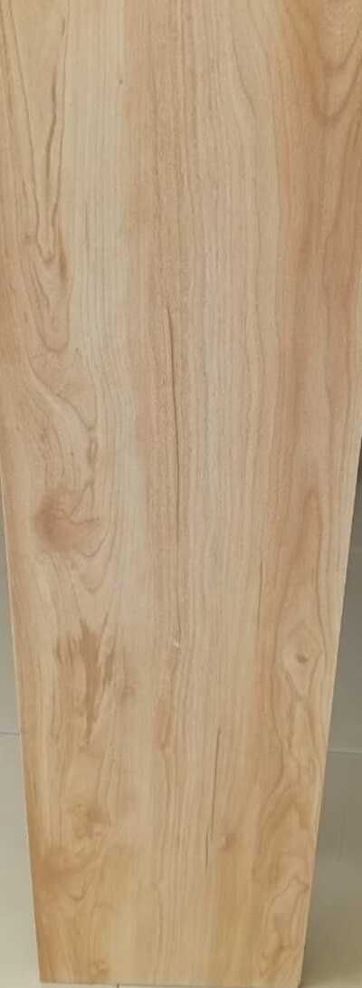 Close-up of a natural-grain wood-look porcelain tile surface